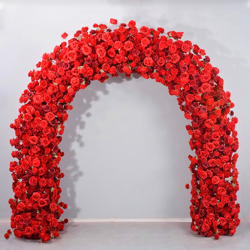 The romantic red rose arch adds a touch of elegance to the event